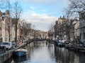 Reflection of Amsterdam famous duch traditional Flemish brick buildings on the canal in Holland, Netherlands Royalty Free Stock Photo